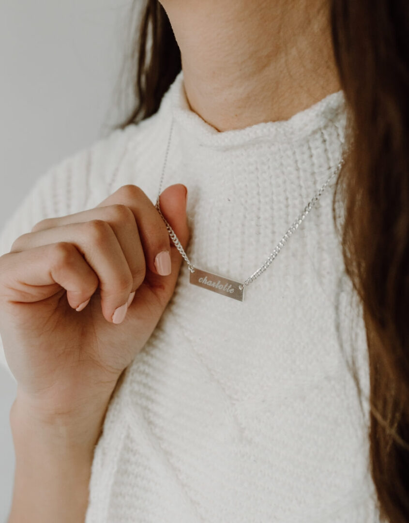 Image of model wearing Engraved Sterling Silver Name Bar Necklace
