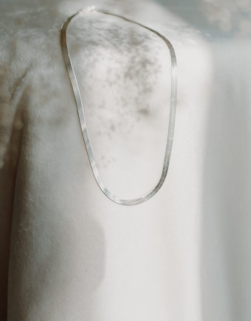 Flatlay Image of Sterling Silver Herringbone Necklace