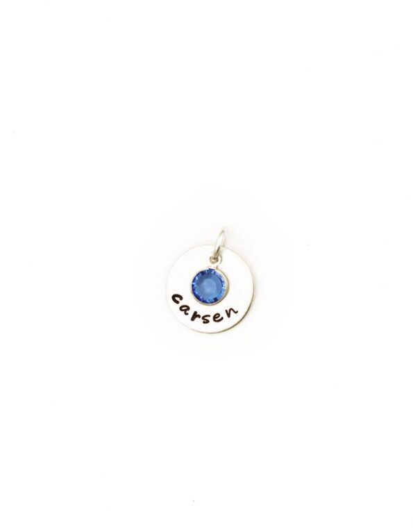 A dainty sterling silver disc with name engraved on it. Add your birthstone in the middle of the disc