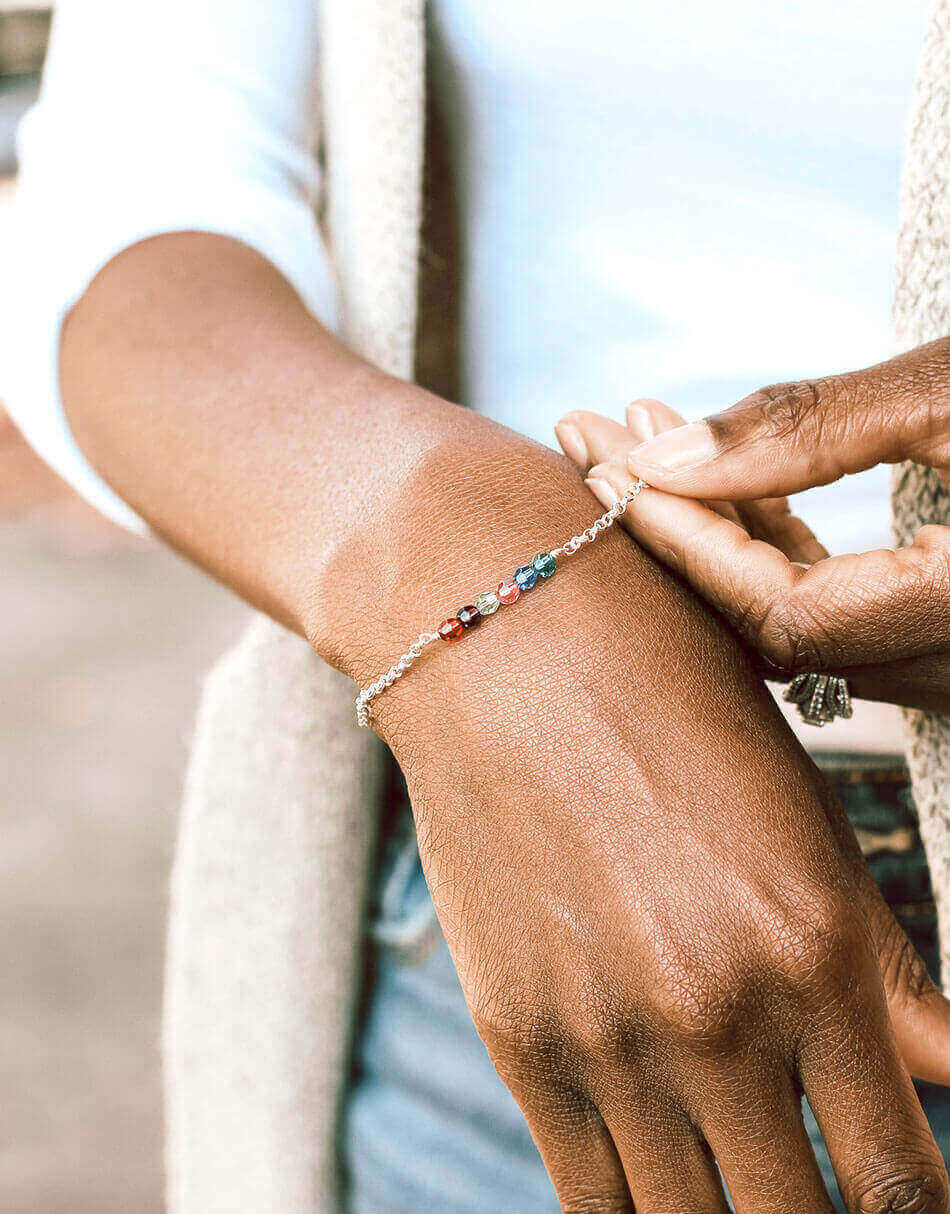 Sterling silver customizable bracelet. Add the Swarovski birthstone crystals representing your family.