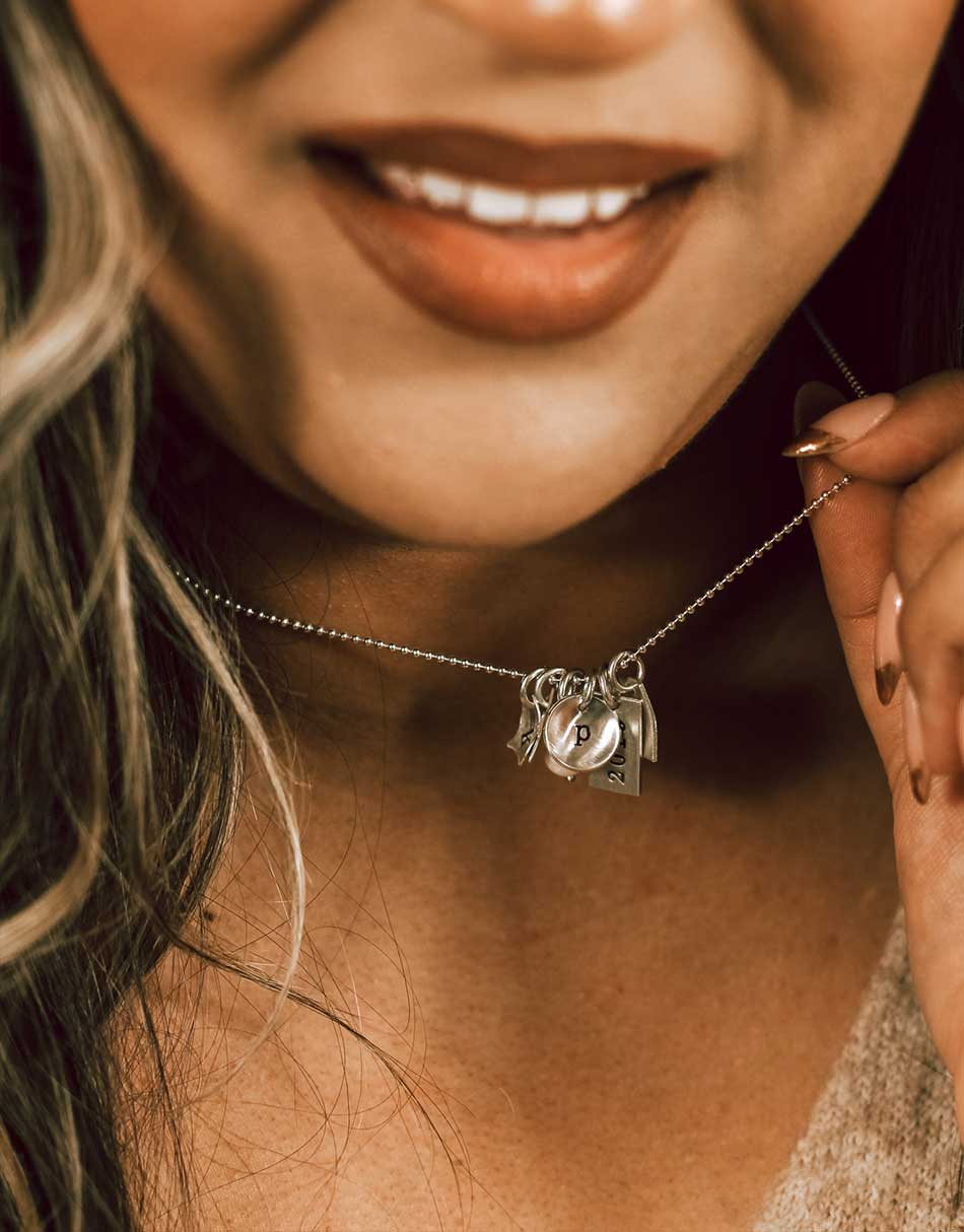 Make your own personalized initial necklace by choosing your favorite charm shapes which fits an initial each
