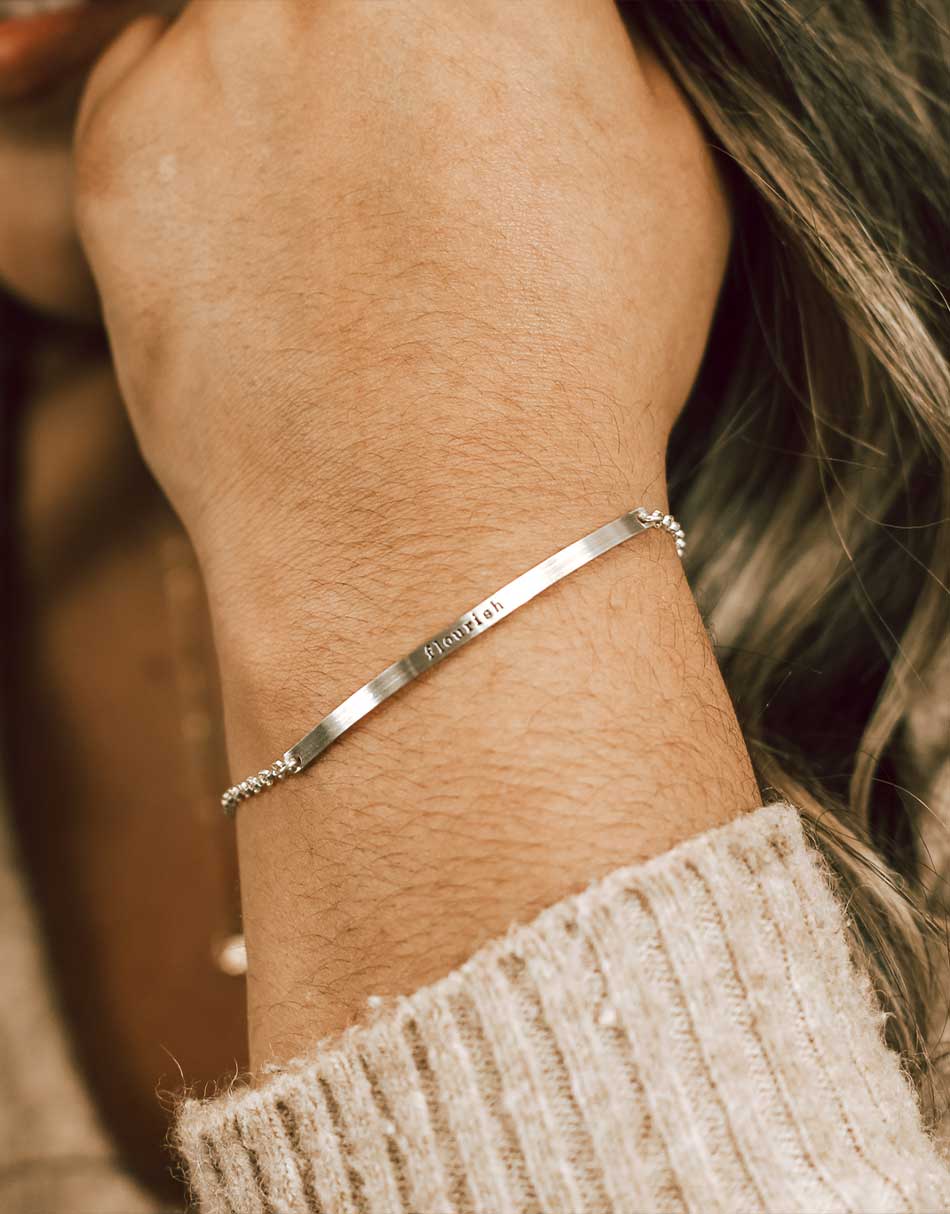 name bar bracelet with names stamped on it