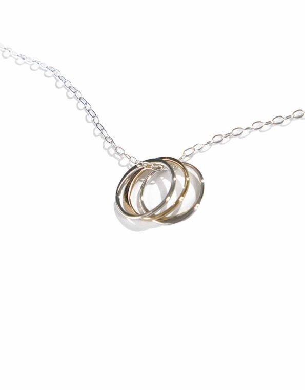 2 sterling silver circles and 1 gold-filled circle, hung on a sterling silver dainty chain. This necklace is symbolic as well as stunning