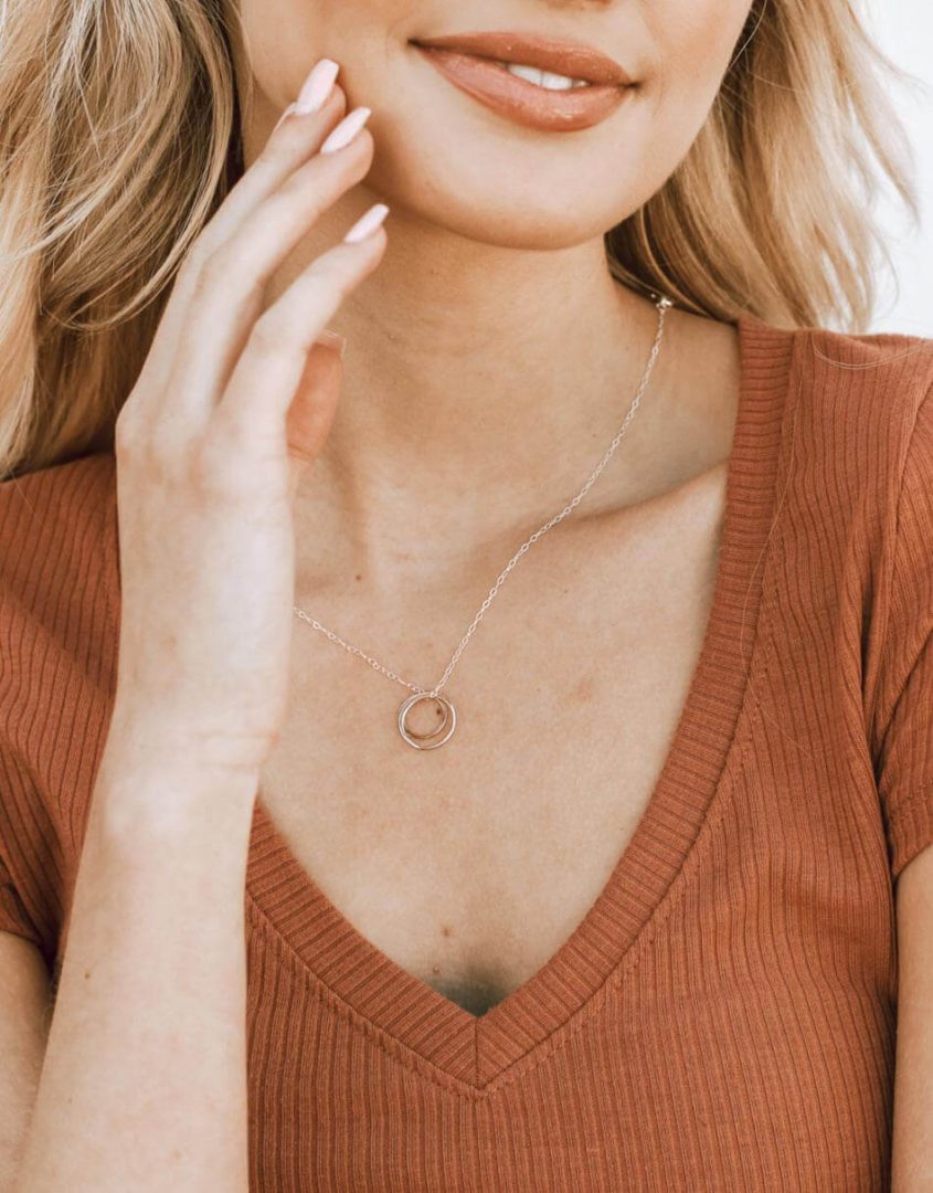 Sterling silver and gold-filled circles all wrapped up in one and hung on a sterling silver dainty chain.