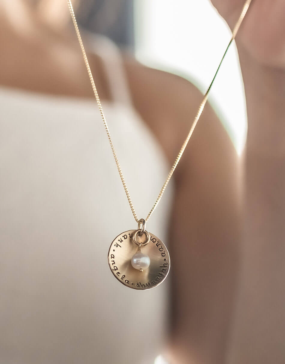 Personalize necklace for mom, grandma, wife. A gold-filled circle with names hand stamped on it