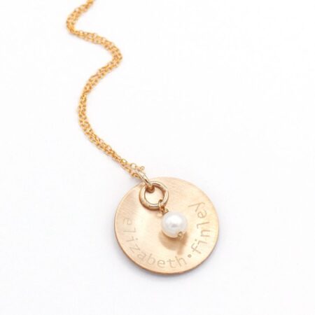 Engraved Gold Names And A Pearl Necklace