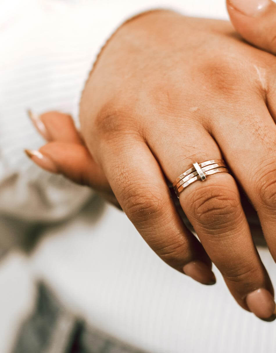 A golden metal “tie” binds together sterling silver rings- each ring represents a member of your family. Personalized Ring for wife or mom
