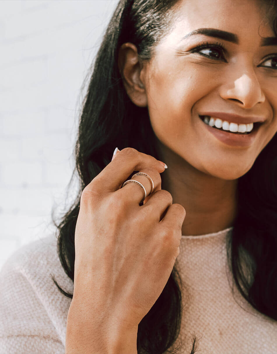 Stacking name rings with names stamped on them