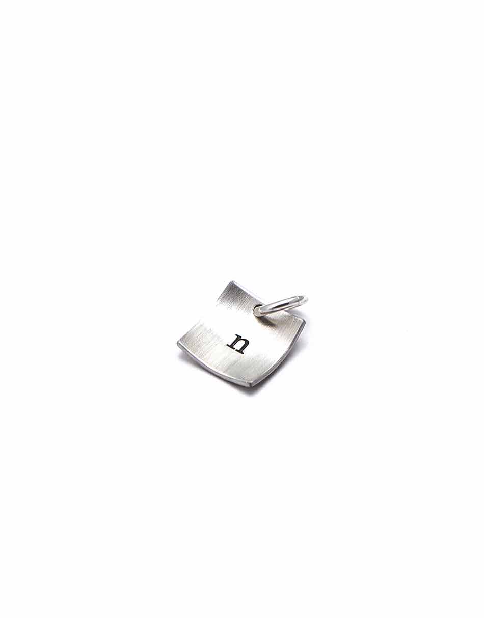 Square sterling silver charm with hand stamped initial. Perfect gift for a girl of any age