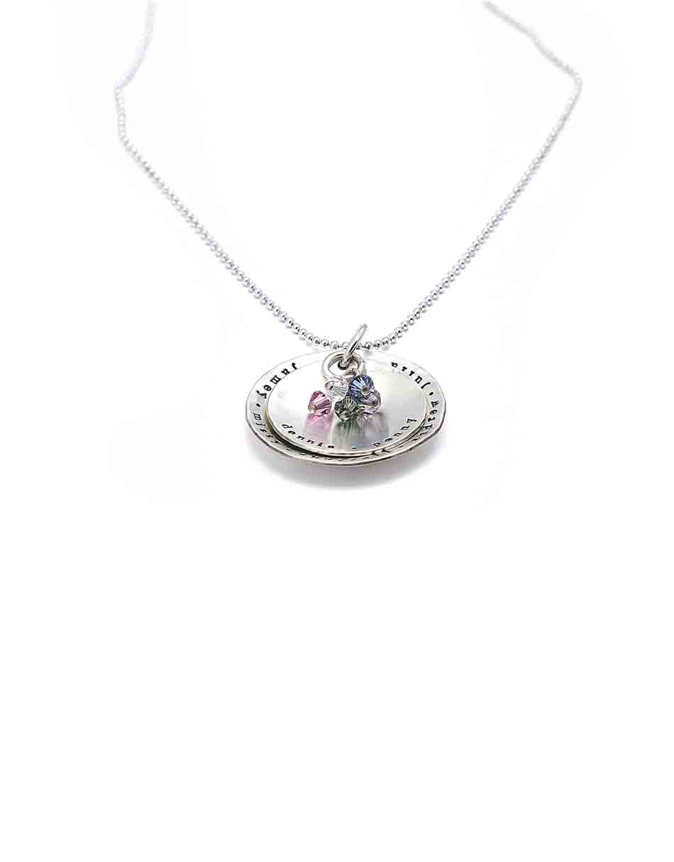 2 layered sterling discs hand stamped with names or dates. Add up to 10 small Swarovski birthstones that match your family!