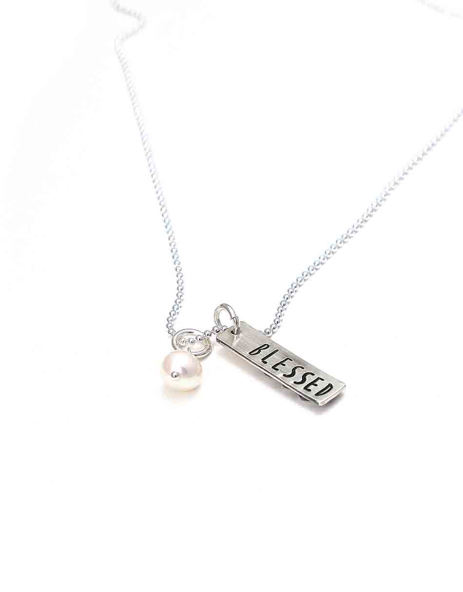 Sterling silver charm with stacked hearts on one side and name hand stamped on the back. Personalized necklace for grandma