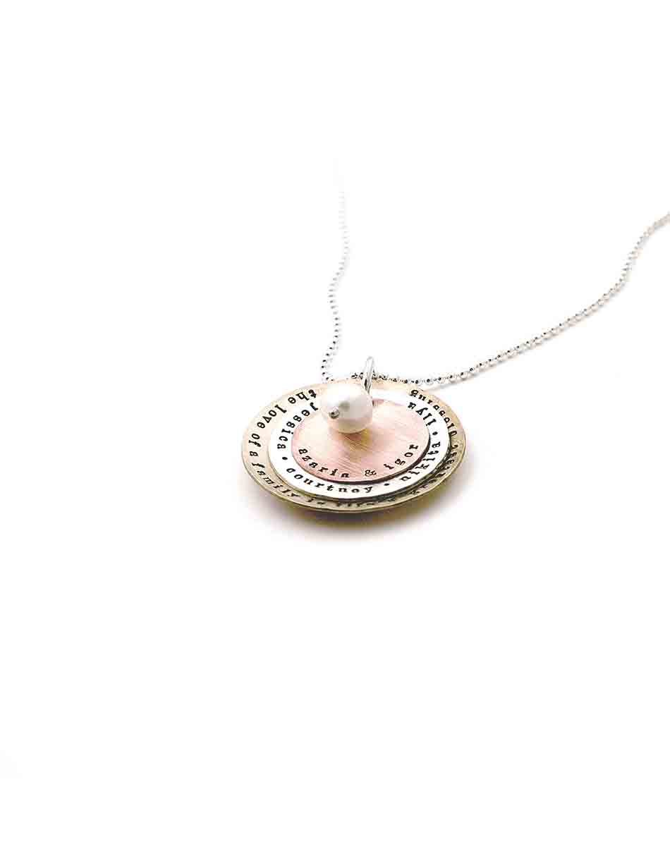 Beautiful layers of brass, sterling silver and copper- each layer hand stamped with names or dates. Personalized jewelry for mom, grandma