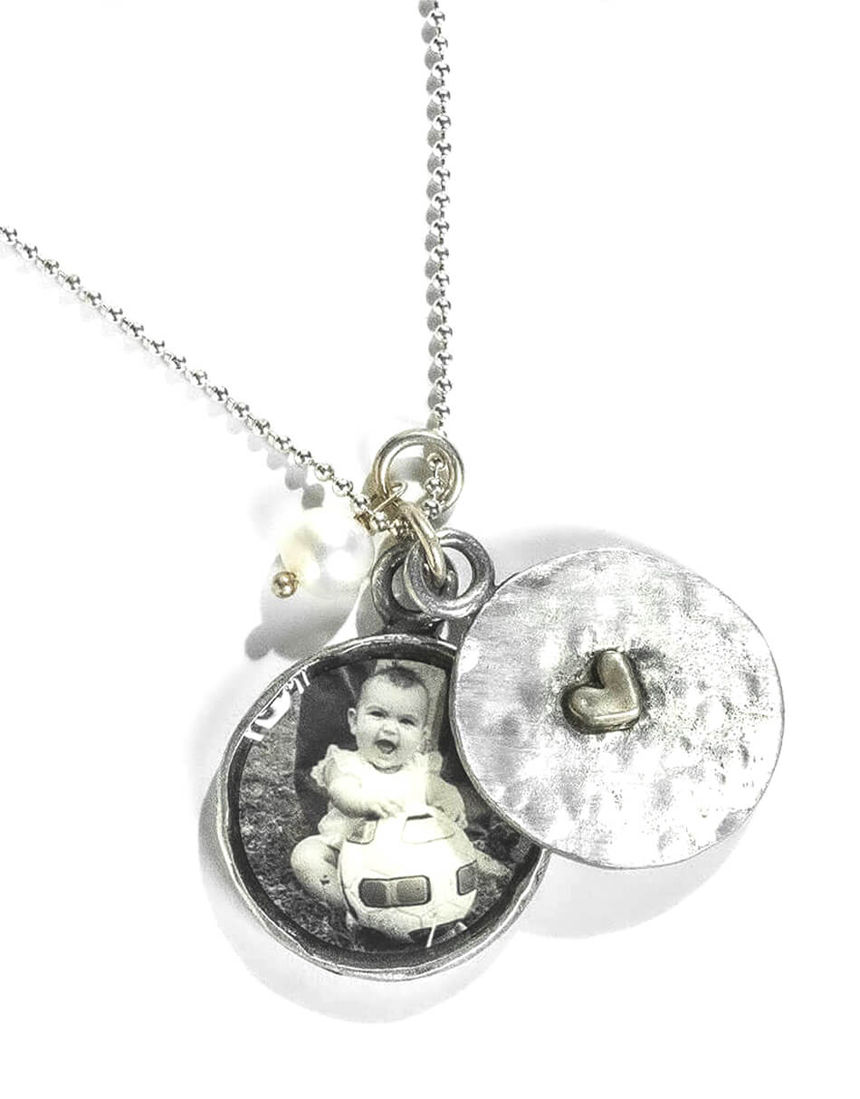 Perfect gift for Mother’s Day. A two piece locket, the top piece hand stamped with name or date and the bottom piece allowing little “peeks” of your photo.
